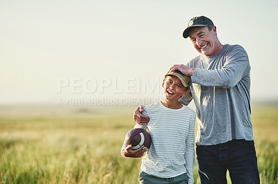 Buy stock photo Father, kid fun and rugby portrait in a countryside field for bonding in nature. Mockup, dad and young boy child together with happiness and smile ready to start game outdoor on farm with space