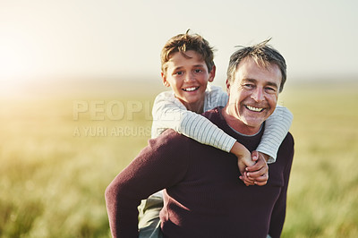 Buy stock photo Portrait of a father and son having fun together outdoors