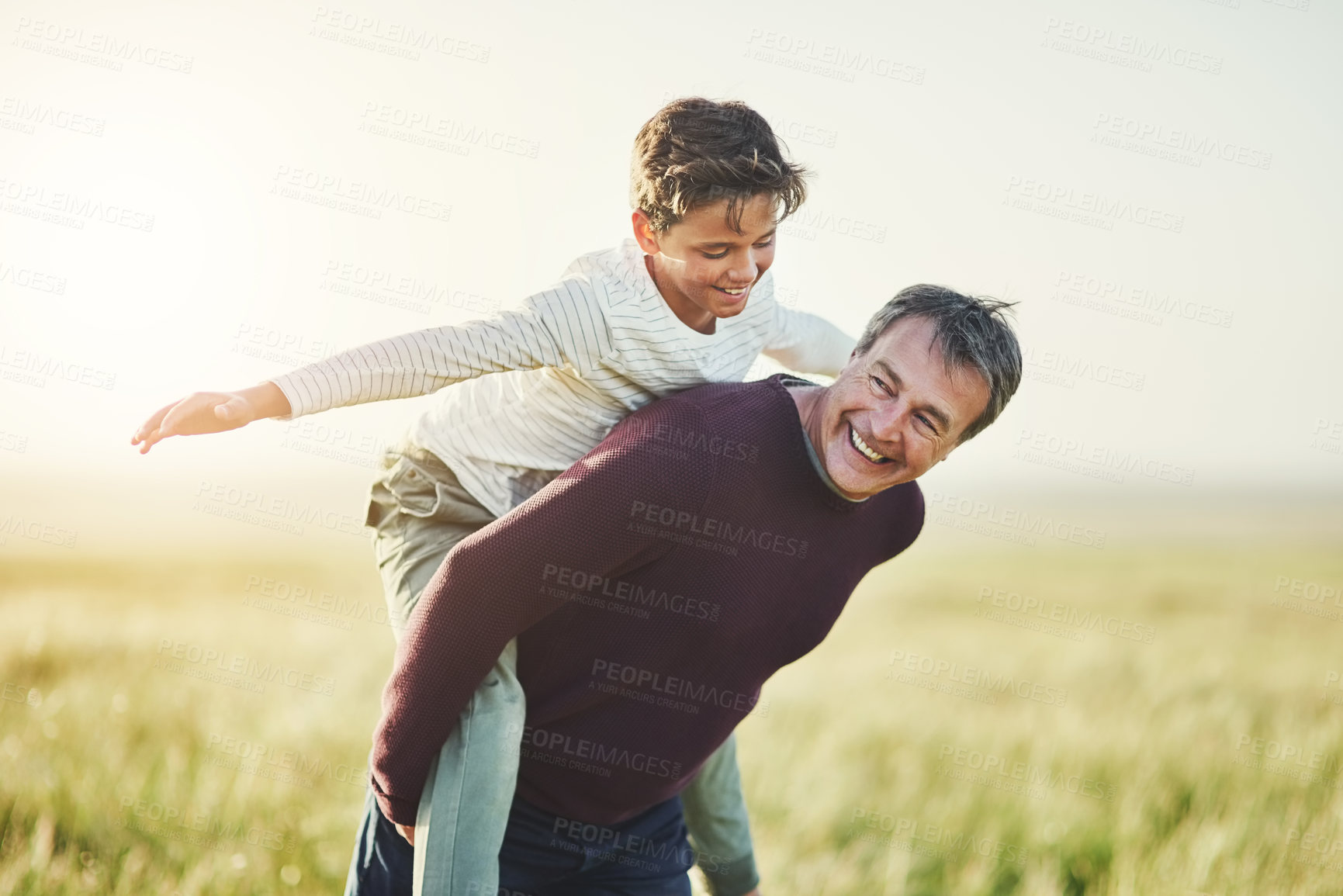 Buy stock photo Airplane, father and carrying of son in nature, love and smile for family in space, sunshine and grass. Countryside, dad and visit of Texas with boy for fresh air, man and bonding with child in farm