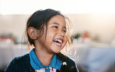 Buy stock photo Happy kid, laughing and girl in a living room, playing and having fun in her home. Child, development and Mexican female toddler with funny, joke or reaction to comedy, goofy and comic in her house