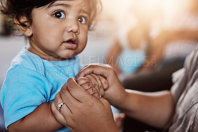 Buy stock photo Child development, love and single parent holding hands of baby closeup in home for bonding or security. Adorable, growth or safety with person and small kid in apartment together for family trust