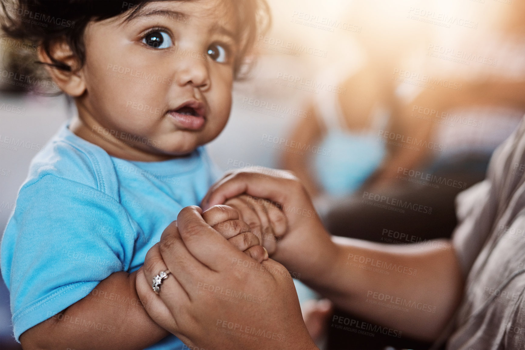 Buy stock photo Child development, love and single parent holding hands of baby closeup in home for bonding or security. Adorable, growth or safety with person and small kid in apartment together for family trust