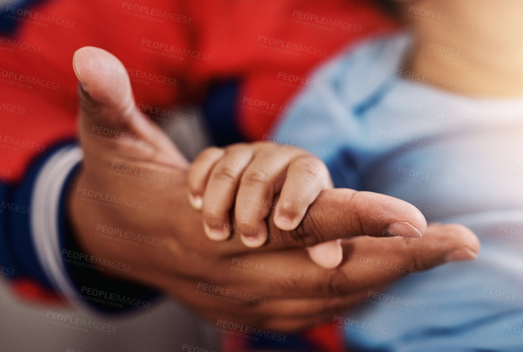 Buy stock photo Parent, baby and holding hands in home for support, care and bonding for child development or growth. People, newborn and closeup as family for love, trust and relax on maternity break for parenthood