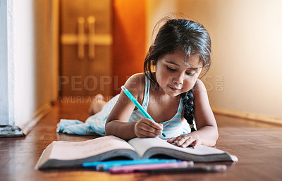 Buy stock photo Book, kid and girl drawing for homework with learning, development and studying for art skills in home. Young, female child and happy toddler writing for creativity, growth and hobby for education