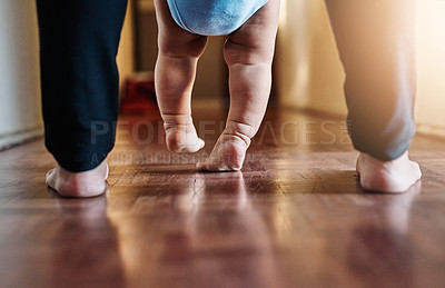 Buy stock photo Person, baby and feet learning to walk house with parent support, trust and progress of mobility development. Family, child and teaching kid first steps, motor growth and helping balance at home