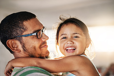 Buy stock photo Smile, child and hug father with love at house for support, safety or care by bonding together in childhood. Girl, man and relax in embrace of gratitude, trust or security of parent in living room
