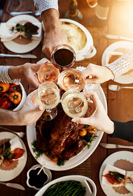 Buy stock photo Wine, food and hands of people toast to celebrate at table for holiday, Christmas or thanksgiving dinner party. Above group of family or friends with drinks for cheers while eating lunch or dinner