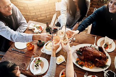 Buy stock photo Food, wine toast and people together for celebration, holiday or dinner party with healthy meal. Above group of friends or family hands cheers to celebrate with drinks, lunch and chicken or turkey