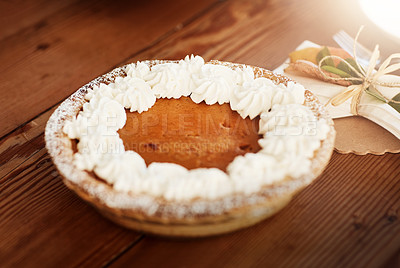 Buy stock photo High angle shot of a pumpkin pie on a Thanksgiving table