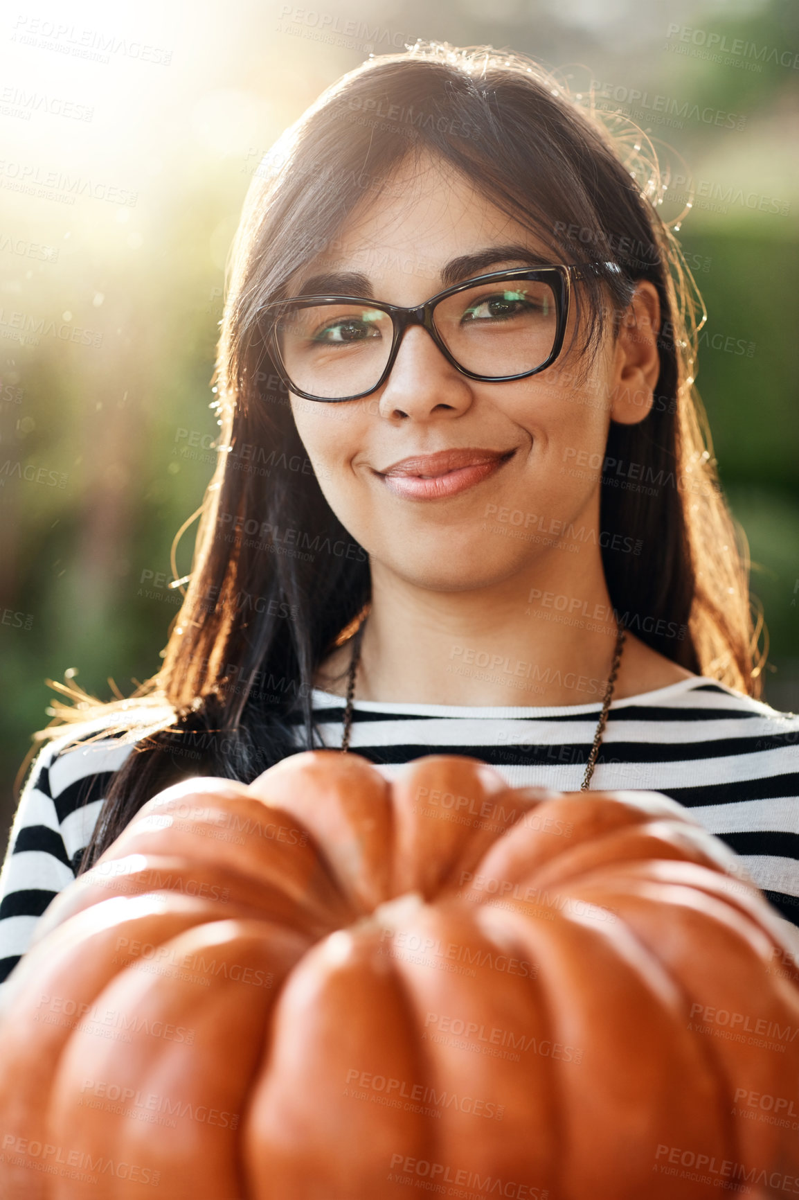 Buy stock photo Festive, portrait and pumpkin with woman outdoor in garden for celebration or thanksgiving event. Face, smile and vegetable with confident person in USA for July holiday or tradition in autumn season