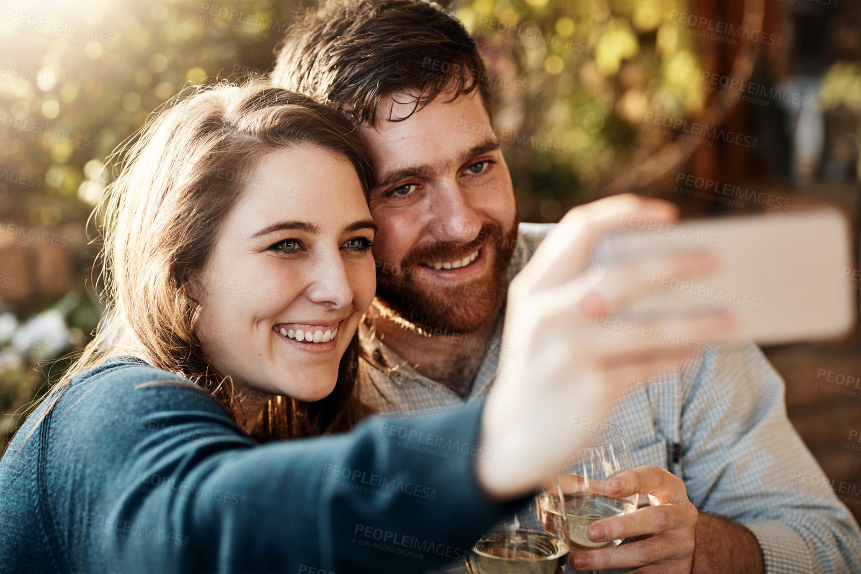 Buy stock photo Couple, phone selfie and outdoor nature on holiday, anniversary celebration and social media post. People, capture memory and online app for photography, travel and alcohol for romance on vacation