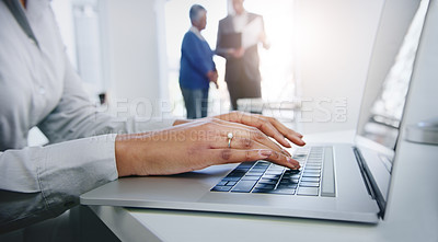 Buy stock photo Shot of a businesswoman using her laptop at the office