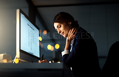Buy stock photo Focus, desktop and businesswoman at night or employee in the office or thinking with pen. Corporate, dark and female manager contemplate or computer and stationery in the evening at workplace 