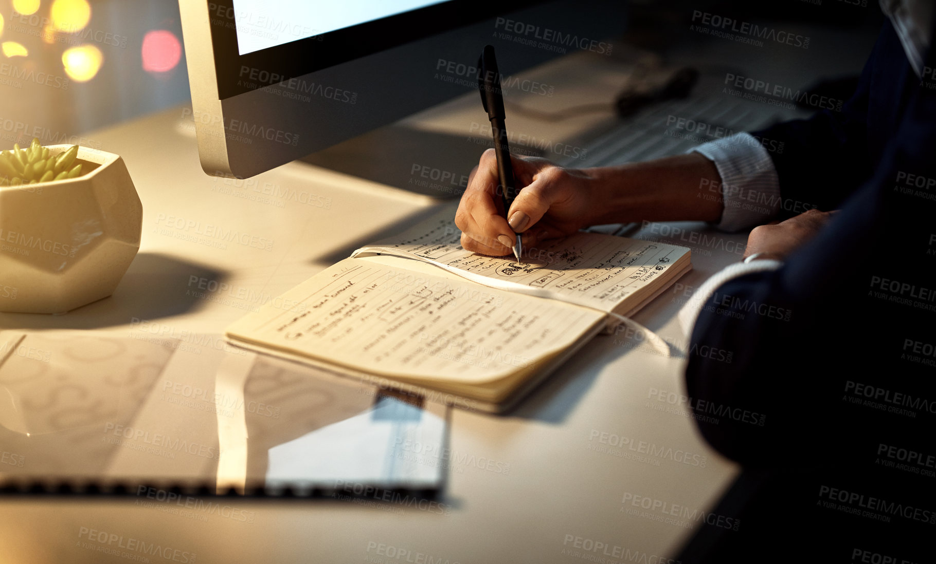 Buy stock photo Hands, writing and notebook for working at night on creative ideas, strategy or schedule at a desk. Closeup of entrepreneur woman with pen and notes for planning, information or goals for a project