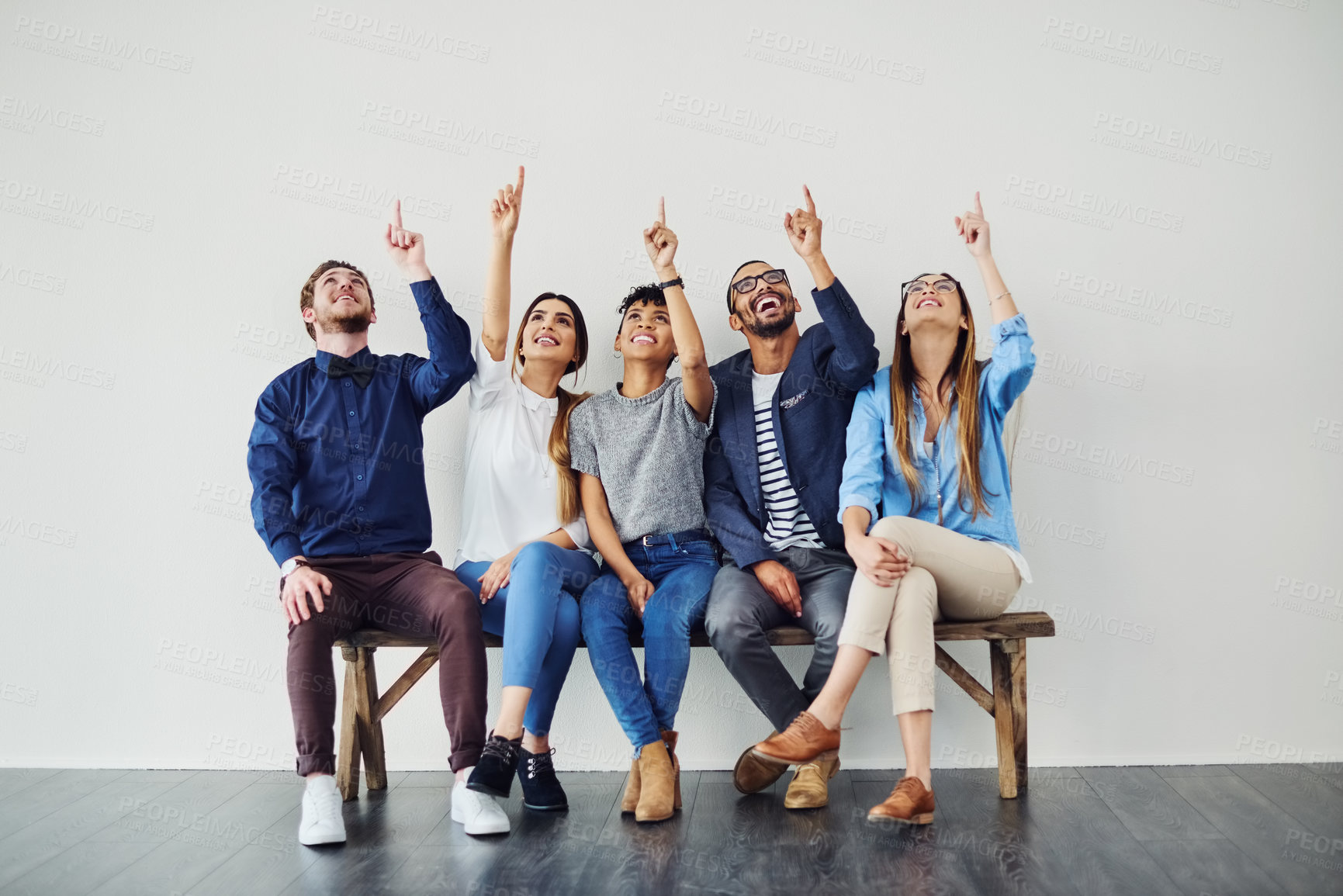 Buy stock photo Business people, diversity and group pointing up for wall, mockup and space with opportunity. Creative employees, teamwork and smile with hand gesture, collaboration and decision for choice approval