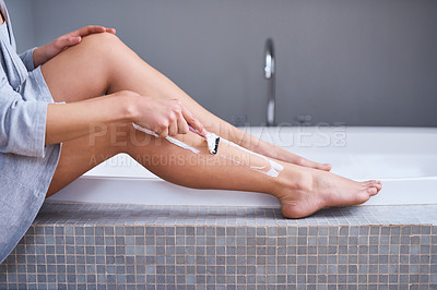 Buy stock photo Shaving, razor and legs of woman in home bathroom for hair removal, epilation and self care. Female person with a shaver in hand for skincare, cleaning body and grooming with foam or soap cosmetics