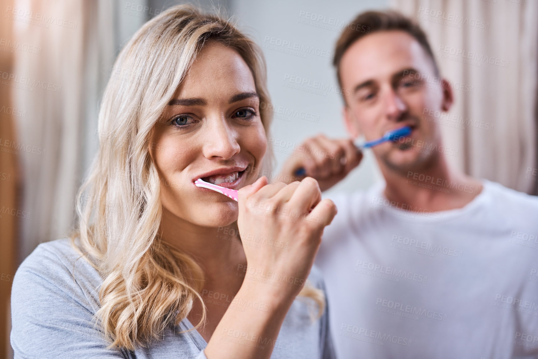 Buy stock photo Portrait, dental and couple brushing teeth in bathroom  with toothbrush for oral hygiene, fresh breath or morning routine. Home, wellness and happy woman with man for whitening, clean or mouth care