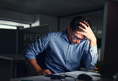 Buy stock photo Stressed, tired business man suffering from headache, working late night in the office. Worried male entrepreneur thinking about problems and project deadline feeling burnout, distress and exhausted.