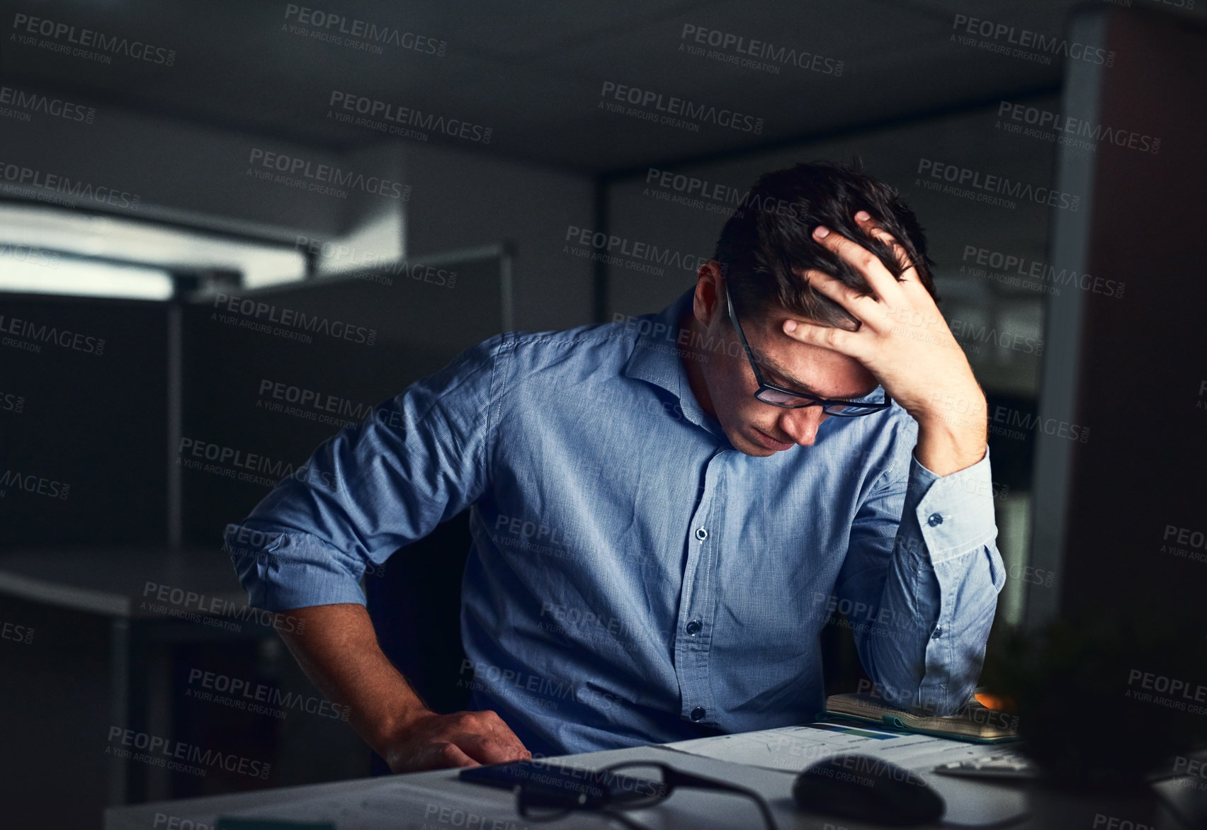 Buy stock photo Stressed, tired business man suffering from headache, working late night in the office. Worried male entrepreneur thinking about problems and project deadline feeling burnout, distress and exhausted.