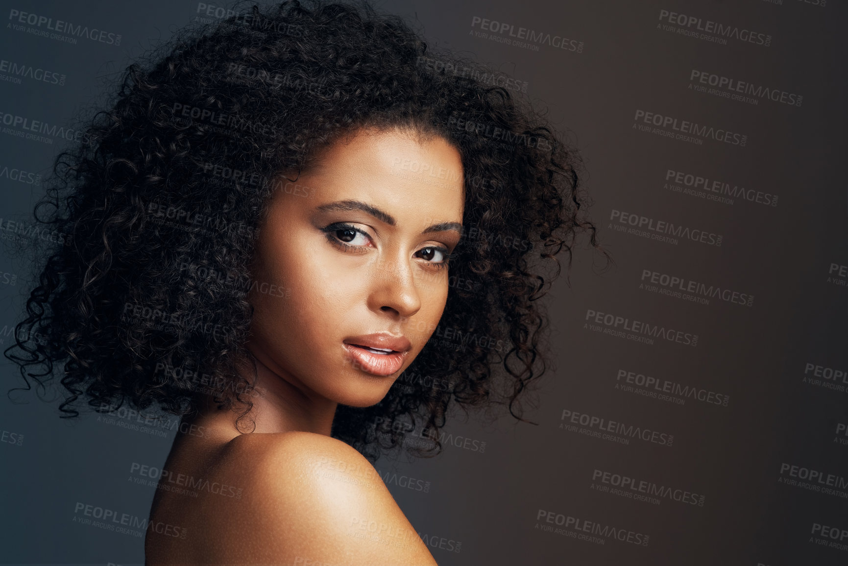 Buy stock photo Beauty, girl and portrait with hair care in studio for curly texture, natural growth and collagen treatment at salon. Confident, woman and cosmetic for transformation, healthy glow on dark background