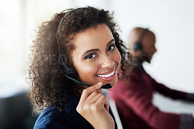 Buy stock photo Cropped portrait of an attractive young female call center agent working in her office