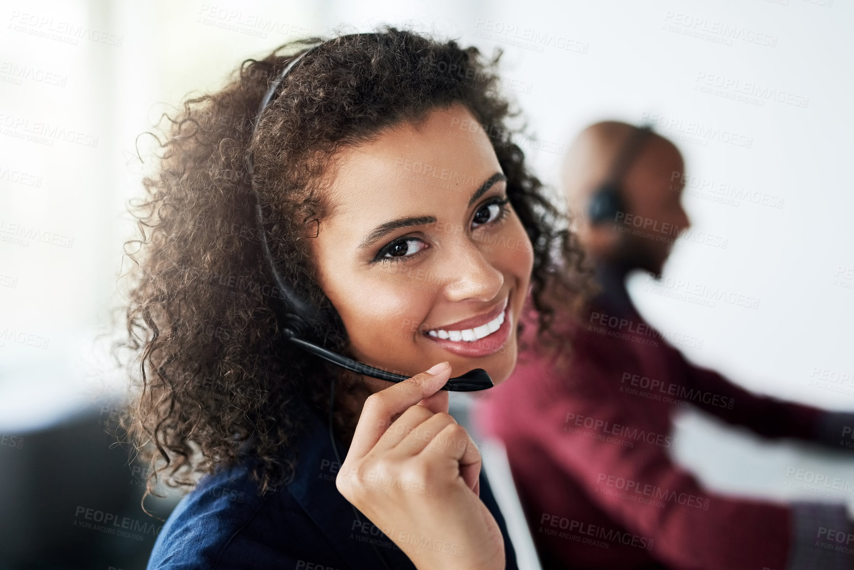 Buy stock photo Cropped portrait of an attractive young female call center agent working in her office