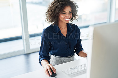 Buy stock photo High angle shot of an attractive young businesswoman working at her desk in the office