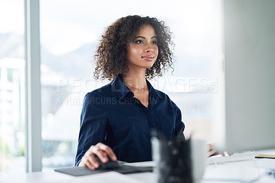Buy stock photo Cropped shot of an attractive young businesswoman working at her desk in the office