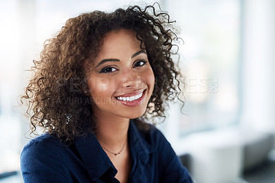 Buy stock photo Cropped portrait of an attractive young businesswoman working at her desk in the office