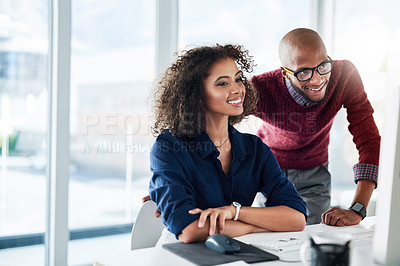 Buy stock photo Cropped shot of a male supervisor helping an attractive young businesswoman while working in their office