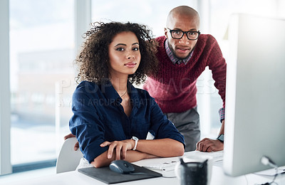 Buy stock photo Cropped portrait of a male supervisor helping an attractive young businesswoman while working in their office