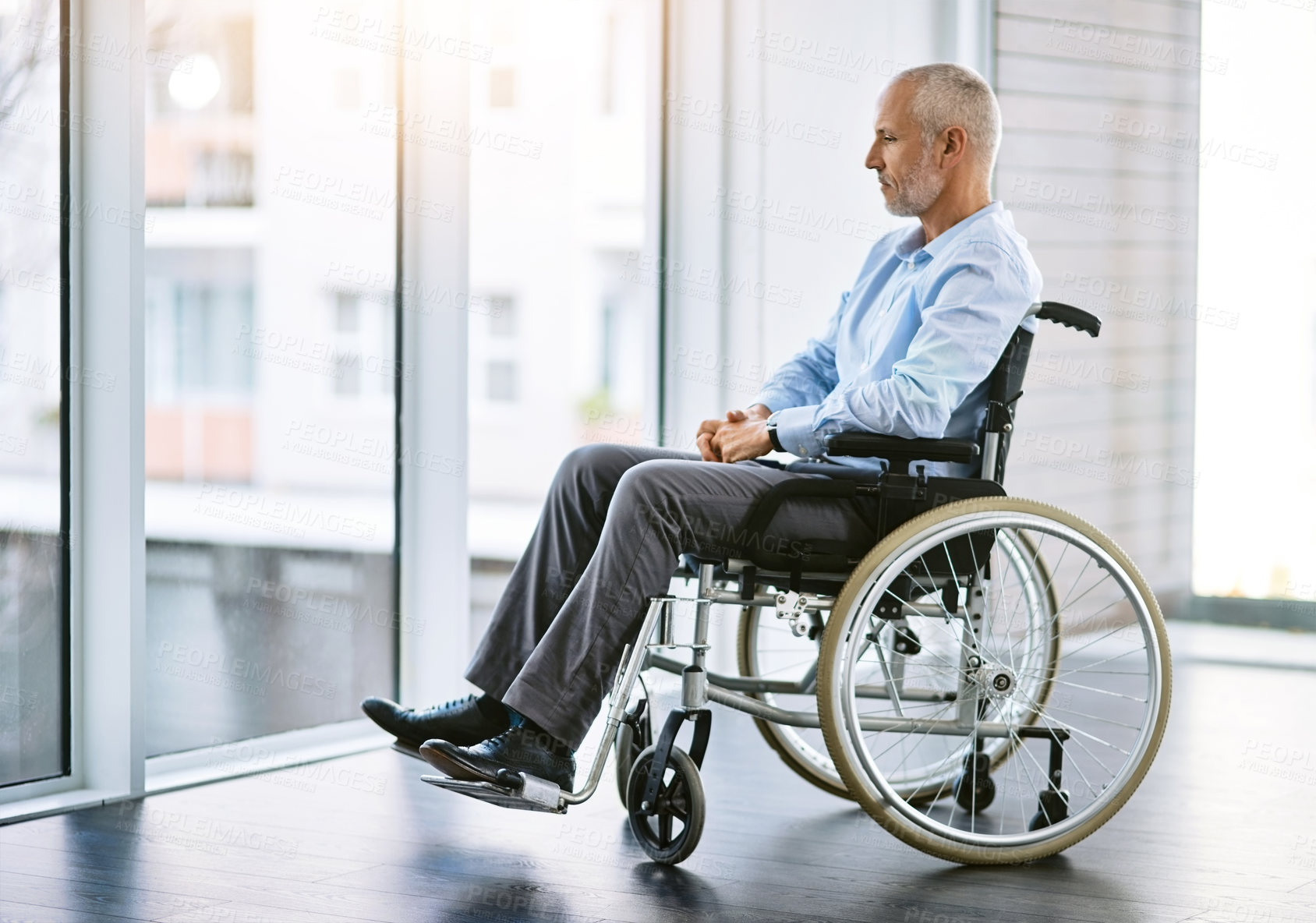 Buy stock photo Man, wheelchair and thinking by window for memories, alone and arthritis in rehabilitation. Paralysed, healthcare and male person with disability in nursing home, decision or mental health of patient