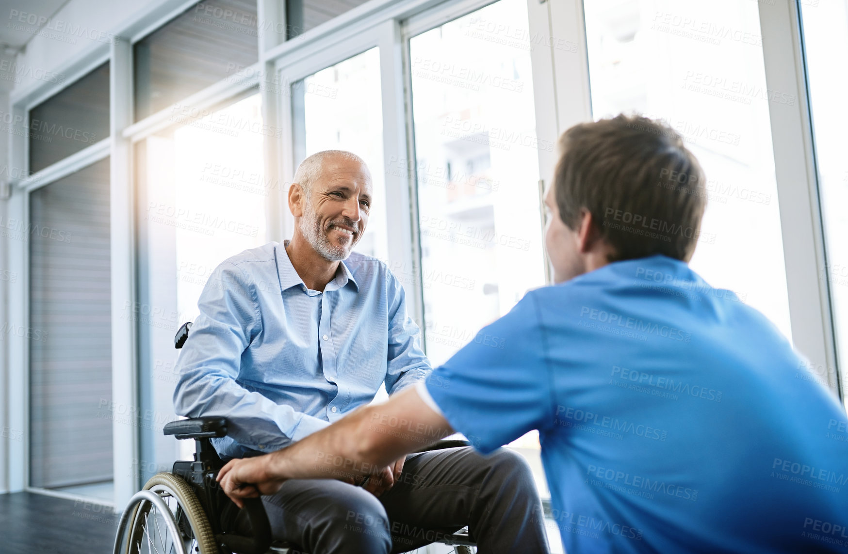 Buy stock photo Shot of a senior patient being cared for by a male nurse