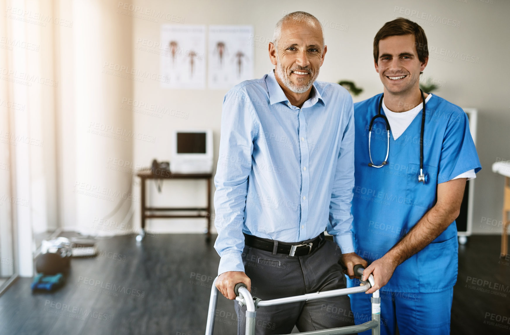 Buy stock photo Portrait of a male nurse assisting a senior patient with a walker