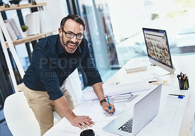 Buy stock photo Shot of a mature male architect working on his laptop