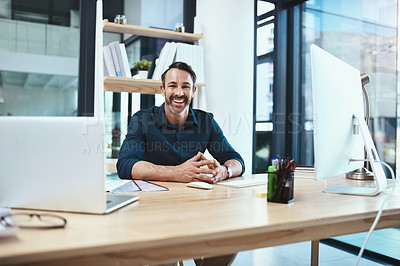 Buy stock photo Portrait of a mature businessman sitting at his desk