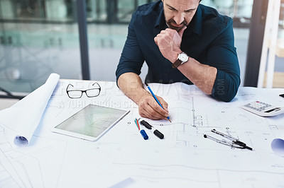 Buy stock photo Shot of a mature male architect working on a design