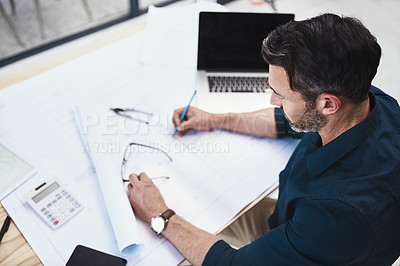 Buy stock photo Man, architect and drawing blueprint for building development for creative process, renovation or project. Male person, floor plan and brainstorming for design engineer or house, laptop or contractor