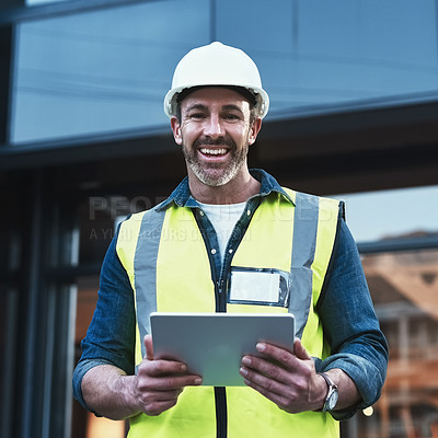 Buy stock photo Shot of a engineer using a digital tablet on a construction site