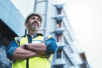 Buy stock photo Shot of a engineer standing in front of a building