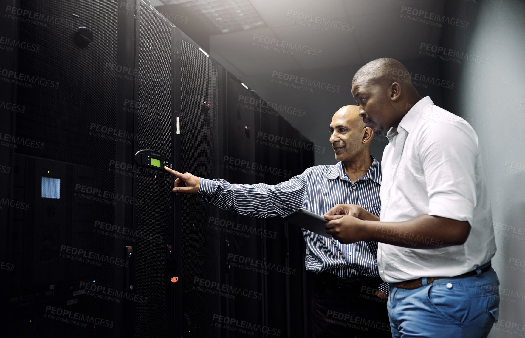 Buy stock photo Server room, people or technicians with tablet for hardware, cybersecurity glitch or error with teamwork. Black man, collaboration or engineers fixing network for information technology or IT support