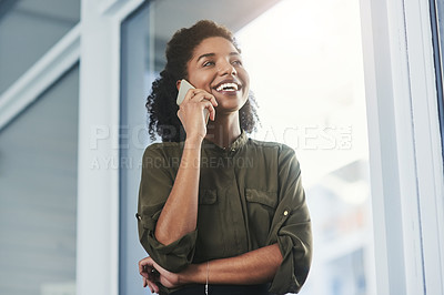 Buy stock photo Shot of a young businesswoman making a phone call in her office