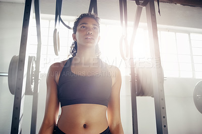 Buy stock photo Serious, woman and fitness with weights at gym for workout, exercise or determination in training. Active or young female person or bodybuilder with slim body in sportswear for health and wellness