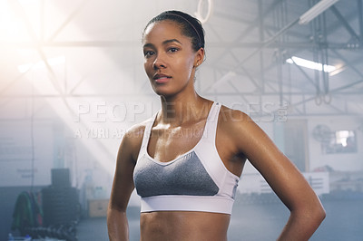 Buy stock photo Portrait of a focused young sportswoman posing in the gym