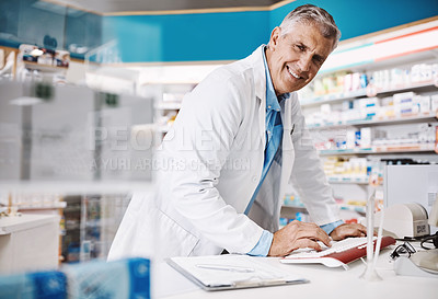 Buy stock photo Shot of a pharmacist working in a drugstore