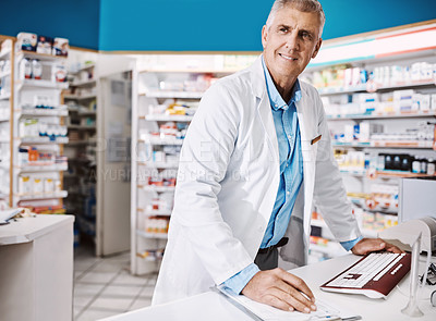 Buy stock photo Shot of a pharmacist working in a drugstore