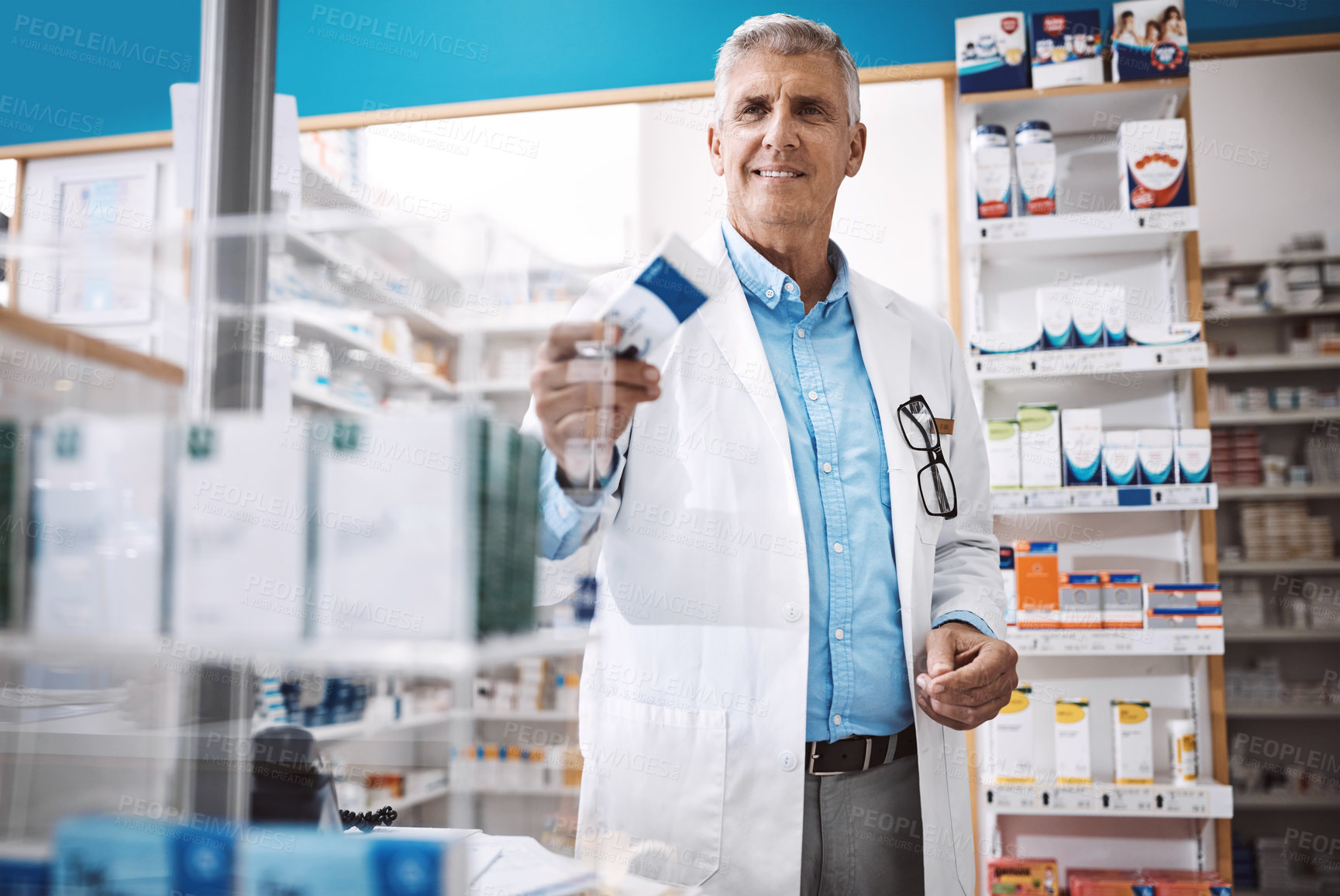 Buy stock photo Shot of a pharmacist working in a drugstore