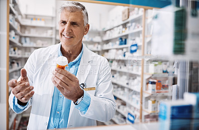 Buy stock photo Shot of a pharmacist working in a drugstore