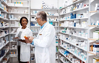 Buy stock photo Medical, people and discussion with tablet in pharmacy for dispensary, inspection and prescription. Healthcare, intern and pharmaceutical student with mentor by pills for inventory, supply and advice