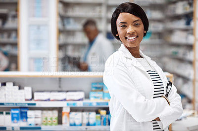 Buy stock photo Shot of a female pharmacist working in a drugstore